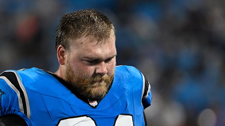 Aug 8, 2025; Charlotte, North Carolina, USA; Carolina Panthers center Cade Mays (64) on the sidelines in the fourth quarter at Bank of America Stadium. Mandatory Credit: Bob Donnan-Imagn Images