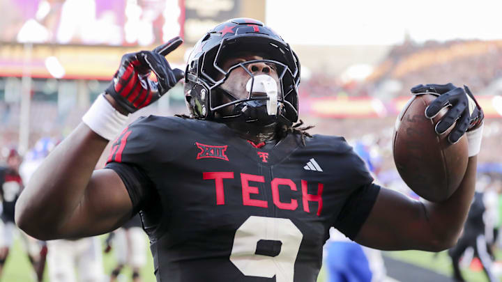 Texas Tech Red Raiders wide receiver Johncarlos Miller (9) reacts after scoring against the Kansas Jayhawks in the first half at Jones AT&T Stadium.