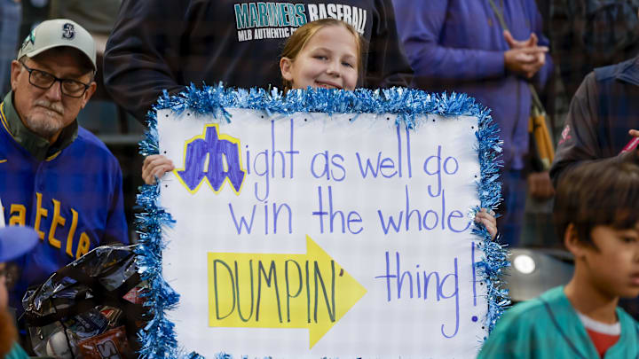Sep 25, 2025; Seattle, Washington, USA; Seattle Mariners fan Hazel Boisjolie, 9, of Des Moines, Wash., holds a sign supporting the Mariners before a game against the Colorado Rockies at T-Mobile Park. Mandatory Credit: Joe Nicholson-Imagn Images