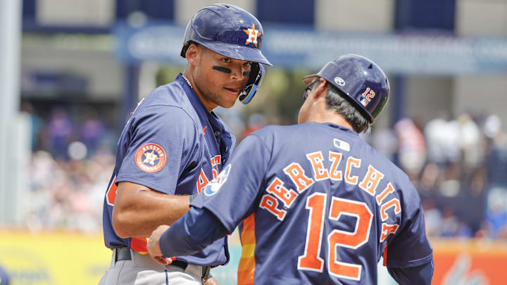 Mar 16, 2025; Port St. Lucie, Florida, USA;  Houston Astros outfielder Cam Smith talks with third base coach Tony Perezchica (12) during the fourth inning against the New York Mets at Clover Park.