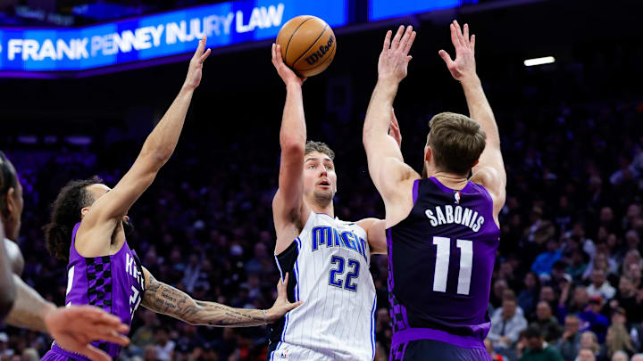 Feb 5, 2025; Sacramento, California, USA; Orlando Magic forward Franz Wagner (22) shoots the ball against Sacramento Kings forward Domantas Sabonis (11) during the second quarter at Golden 1 Center. Mandatory Credit: Sergio Estrada-Imagn Images