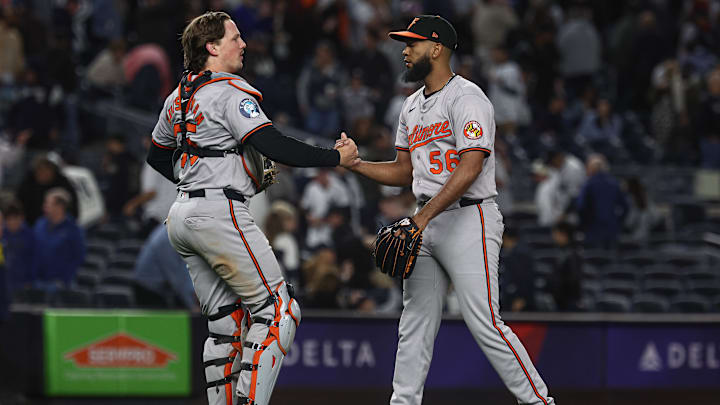 Sep 24, 2024; Bronx, New York, USA; Baltimore Orioles relief pitcher Seranthony Dominguez (56) and catcher Adley Rutschman (35) celebrates after defeating the New York Yankees at Yankee Stadium. Sep 24, 2024; Bronx, New York, USA; Baltimore Orioles relief pitcher Seranthony Dominguez (56) and catcher Adley Rutschman (35) celebrates after defeating the New York Yankees at Yankee Stadium.