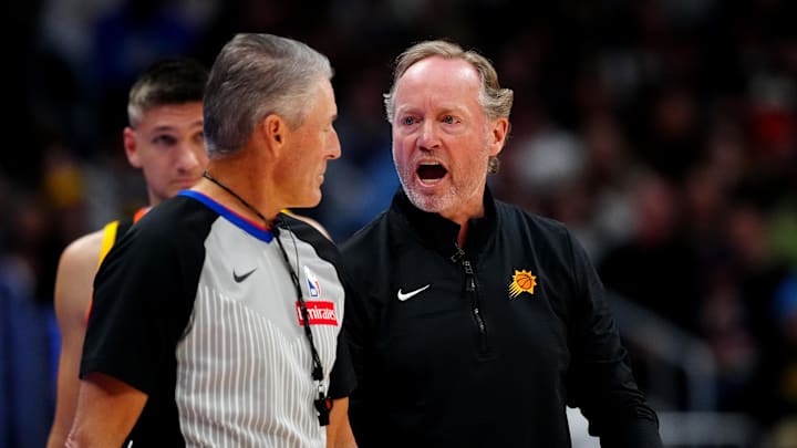 Mar 7, 2025; Denver, Colorado, USA; Phoenix Suns head coach Mike Budenholzer reacts towards referee Scott Foster (48) during the second quarter against the Denver Nuggets at Ball Arena. Mandatory Credit: Ron Chenoy-Imagn Images