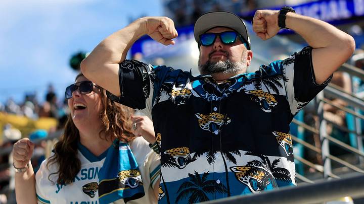 Asa Maass flexes next to wife Priscilla after a touchdown  score during the third quarter of an NFL football matchup at EverBank Stadium on Sunday, Sept. 27, 2026, in Jacksonville, Fla. The Jaguars defeated the Patriots 35-6. 