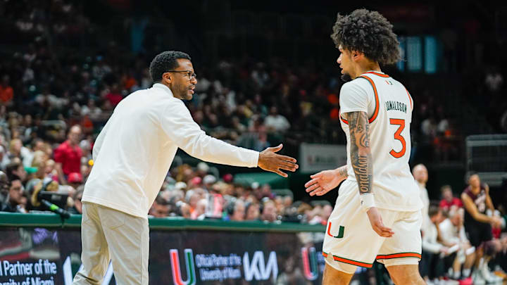 Mar 7, 2026; Coral Gables, Florida, USA; Miami Hurricanes head coach Jai Lucas congratulates guard Tre Donaldson (3) against the Louisville Cardinals during the second half at Watsco Center. Mandatory Credit: Jeff Romance-Imagn Images