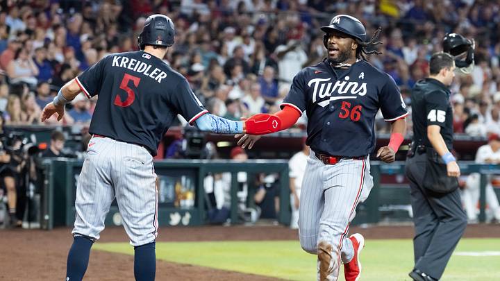 Jun 21, 2026; Phoenix, Arizona, USA; Minnesota Twins outfielder Josh Bell celebrates with Ryan Kreidler after scoring in the seventh inning against the Arizona Diamondbacks at Chase Field. Mandatory Credit: Mark J. Rebilas-Imagn Images Jun 21, 2026; Phoenix, Arizona, USA; Minnesota Twins outfielder Josh Bell celebrates with Ryan Kreidler after scoring in the seventh inning against the Arizona Diamondbacks at Chase Field. Mandatory Credit: Mark J. Rebilas-Imagn Images