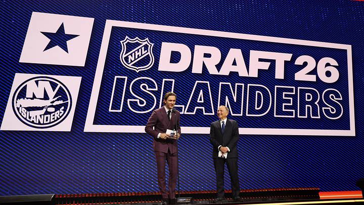 Jun 26, 2026; Buffalo, New York, USA; New York Islanders player Matthew Schaefer announces the thirteenth pick in the first round of the 2026 NHL Draft in front of NHL commissioner Gary Bettman at KeyBank Center. Mandatory Credit: Timothy T. Ludwig-Imagn Images