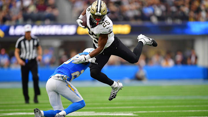 New Orleans Saints running back Kendre Miller (25) runs the ball against the Los Angeles Chargers