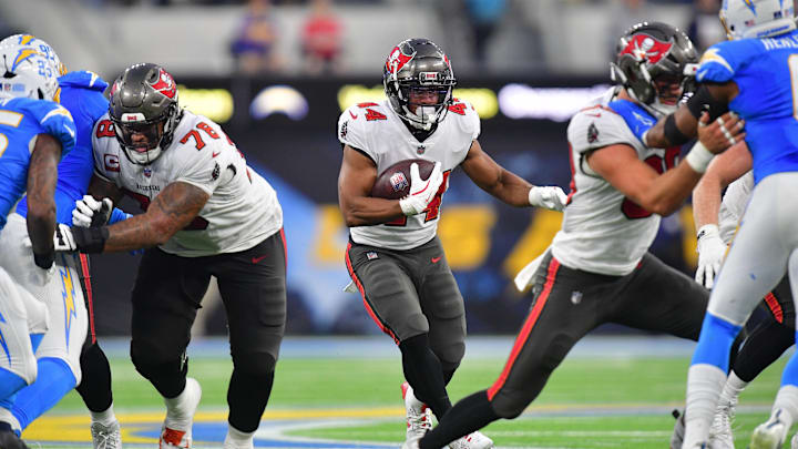 Dec 15, 2024; Inglewood, California, USA; Tampa Bay Buccaneers running back Sean Tucker (44) runs the ball against the Los Angeles Chargers during the second half at SoFi Stadium. Mandatory Credit: Gary A. Vasquez-Imagn Images Dec 15, 2024; Inglewood, California, USA; Tampa Bay Buccaneers running back Sean Tucker (44) runs the ball against the Los Angeles Chargers during the second half at SoFi Stadium. Mandatory Credit: Gary A. Vasquez-Imagn Images