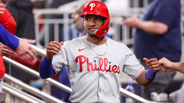 Jun 27, 2025; Atlanta, Georgia, USA; Philadelphia Phillies center fielder Johan Rojas (23) celebrates with teammates after scoring a run against the Atlanta Braves in the ninth inning at Truist Park. Mandatory Credit: Brett Davis-Imagn Images

