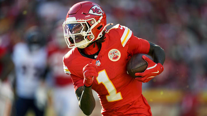 Nov 10, 2024; Kansas City, Missouri, USA; Kansas City Chiefs wide receiver Xavier Worthy (1) runs with the ball during the second half against the Denver Broncos at GEHA Field at Arrowhead Stadium. Mandatory Credit: Jay Biggerstaff-Imagn Images