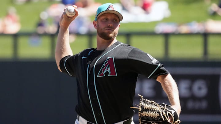 Mar 18, 2026; Salt River Pima-Maricopa, Arizona, USA; Arizona Diamondbacks pitcher Merrill Kelly (29) throws against the Chicago Cubs in the first inning at Salt River Fields at Talking Stick. Mandatory Credit: Rick Scuteri-Imagn Images