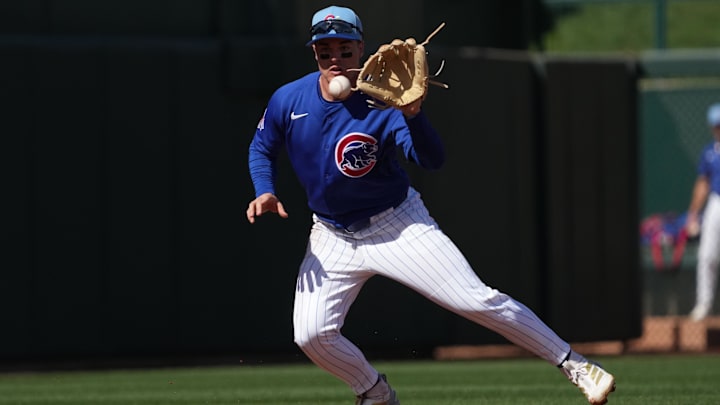 Feb 24, 2026; Mesa, Arizona, USA; Chicago Cubs third baseman Matt Shaw (6) makes the play for an out against the San Diego Padres in the second inning at Sloan Park. Mandatory Credit: Rick Scuteri-Imagn Images