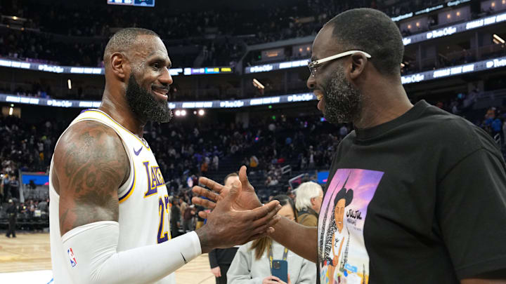 Jan 25, 2025; San Francisco, California, USA; Los Angeles Lakers forward LeBron James (left) talks with Golden State Warriors forward Draymond Green (right) after the game at Chase Center. Mandatory Credit: Darren Yamashita-Imagn Images