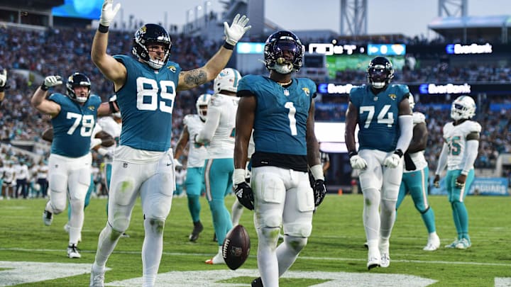 Jacksonville Jaguars running back Travis Etienne Jr. (1) scores a touchdown during the second.