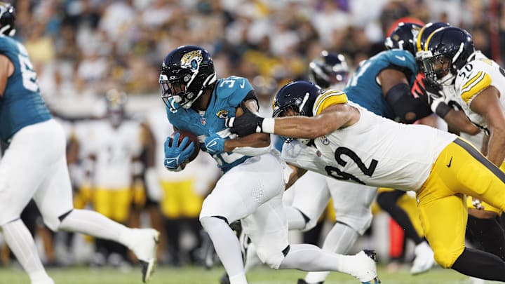 Aug 9, 2025; Jacksonville, Florida, USA; Pittsburgh Steelers defensive tackle Isaiahh Loudermilk (92) tackles Jacksonville Jaguars running back Bhayshul Tuten (33) during the second quarter at EverBank Stadium. Aug 9, 2025; Jacksonville, Florida, USA; Pittsburgh Steelers defensive tackle Isaiahh Loudermilk (92) tackles Jacksonville Jaguars running back Bhayshul Tuten (33) during the second quarter at EverBank Stadium.