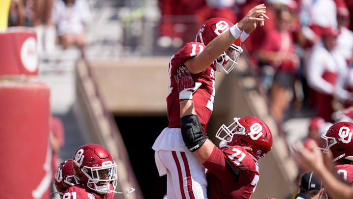 Oklahoma Sooners quarterback Jackson Arnold (11) celebrates with Oklahoma Sooners offensive lineman Logan Howland (71) after scoring a touchdown during a college football game between the University of Oklahoma Sooners (OU) and the Tulane Green Wave at Gaylord Family - Oklahoma Memorial Stadium in Norman, Okla., Saturday, Sept. 14, 2024.