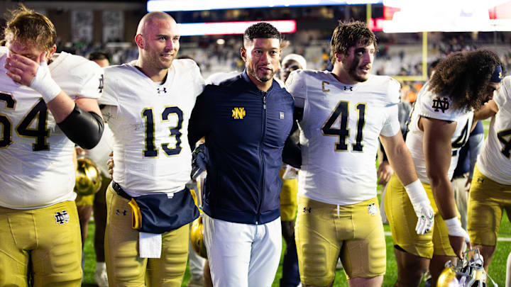 Nov 1, 2025; Chestnut Hill, Massachusetts, USA; Notre Dame Fighting Irish head coach Marcus Freeman, Notre Dame Fighting Irish quarterback CJ Carr (13) and Notre Dame Fighting Irish defensive lineman Donovan Hinish (41) after the game against the Boston College Eagles at Alumni Stadium. Mandatory Credit: Edward Finan-Imagn Images