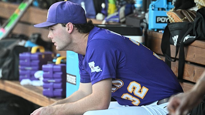 Jun 21, 2025; Omaha, Neb, USA; LSU Tigers starting pitcher Kade Anderson (32) sits in the dugout between the eighth and ninth innings against the Coastal Carolina Chanticleers at Charles Schwab Field. Mandatory Credit: Steven Branscombe-Imagn Images Jun 21, 2025; Omaha, Neb, USA; LSU Tigers starting pitcher Kade Anderson (32) sits in the dugout between the eighth and ninth innings against the Coastal Carolina Chanticleers at Charles Schwab Field. Mandatory Credit: Steven Branscombe-Imagn Images