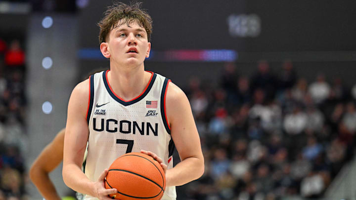 Oct 28, 2025; Hartford, CT, USA; Connecticut Huskies guard Jacob Furphy (7) shoots a free throw during the first half against the Michigan State Spartans at PeoplesBank Arena. Mandatory Credit: Mark Smith-Imagn Images