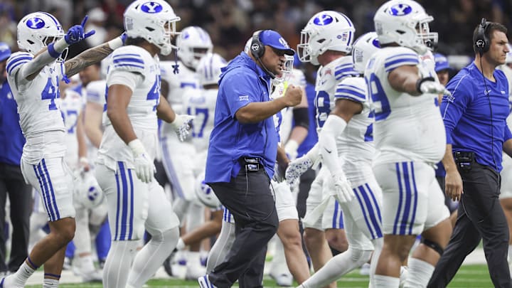 Dec 28, 2024; San Antonio, TX, USA; Brigham Young Cougars head coach Kalani Sitake reacts after a play during the second quarter against the Colorado Buffaloes at Alamodome. Mandatory Credit: Troy Taormina-Imagn Images Dec 28, 2024; San Antonio, TX, USA; Brigham Young Cougars head coach Kalani Sitake reacts after a play during the second quarter against the Colorado Buffaloes at Alamodome. Mandatory Credit: Troy Taormina-Imagn Images