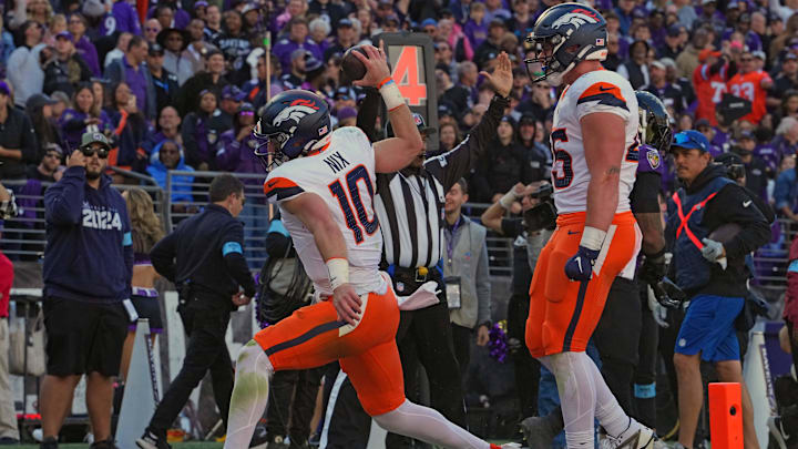 Nov 3, 2024; Baltimore, Maryland, USA; Denver Broncos quarterback Bo Nix (10) reacts following his second quarter touchdown catch against the Baltimore Ravens at M&T Bank Stadium. Mandatory Credit: Mitch Stringer-Imagn Images