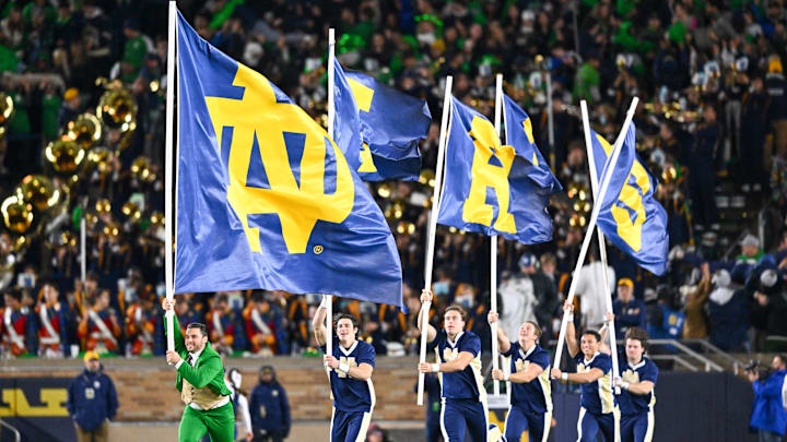 Oct 14, 2023; South Bend, Indiana, USA; The Notre Dame Leprechaun and cheerleaders celebrate after a Notre Dame touchdown in the third quarter against the USC Trojans at Notre Dame Stadium. Mandatory Credit: Matt Cashore-Imagn Images Oct 14, 2023; South Bend, Indiana, USA; The Notre Dame Leprechaun and cheerleaders celebrate after a Notre Dame touchdown in the third quarter against the USC Trojans at Notre Dame Stadium. Mandatory Credit: Matt Cashore-Imagn Images