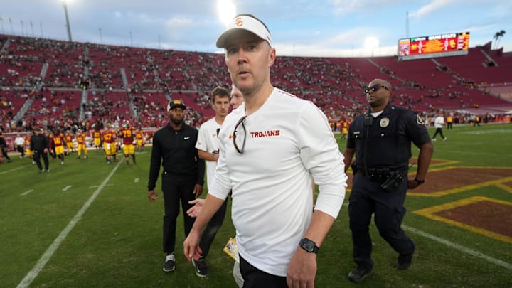 Nov 30, 2024; Los Angeles, California, USA; Southern California Trojans head coach Lincoln Riley leaves the field after the game against the Notre Dame Fighting Irish at United Airlines Field at Los Angeles Memorial Coliseum. Mandatory Credit: Kirby Lee-Imagn Images