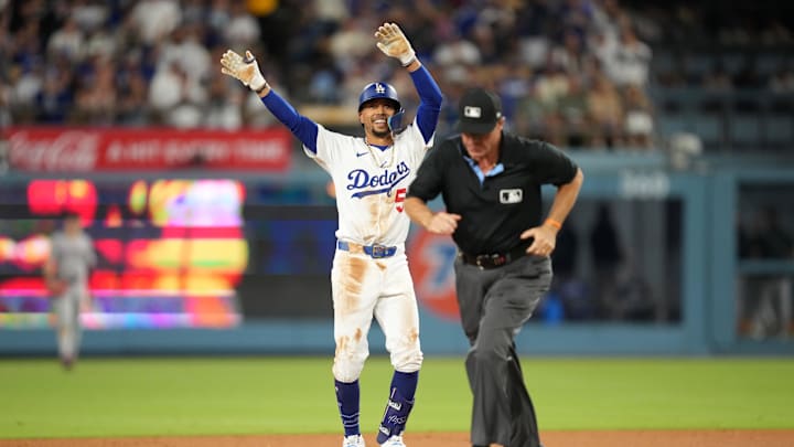 Aug 29, 2025; Los Angeles, California, USA; Los Angeles Dodgers shortstop Mookie Betts (50) reacts after hitting a double against the Arizona Diamondbacks in the sixth inning at Dodger Stadium. Mandatory Credit: Kirby Lee-Imagn Images