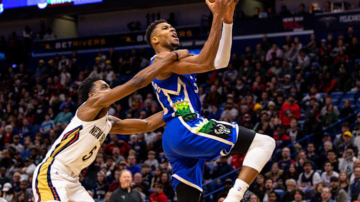 Dec 19, 2022; New Orleans, Louisiana, USA; New Orleans Pelicans forward Herbert Jones (5) fouls Milwaukee Bucks forward Giannis Antetokounmpo (34) as he drives to the basket during the first half at Smoothie King Center. Mandatory Credit: Stephen Lew-Imagn Images Dec 19, 2022; New Orleans, Louisiana, USA; New Orleans Pelicans forward Herbert Jones (5) fouls Milwaukee Bucks forward Giannis Antetokounmpo (34) as he drives to the basket during the first half at Smoothie King Center. Mandatory Credit: Stephen Lew-Imagn Images
