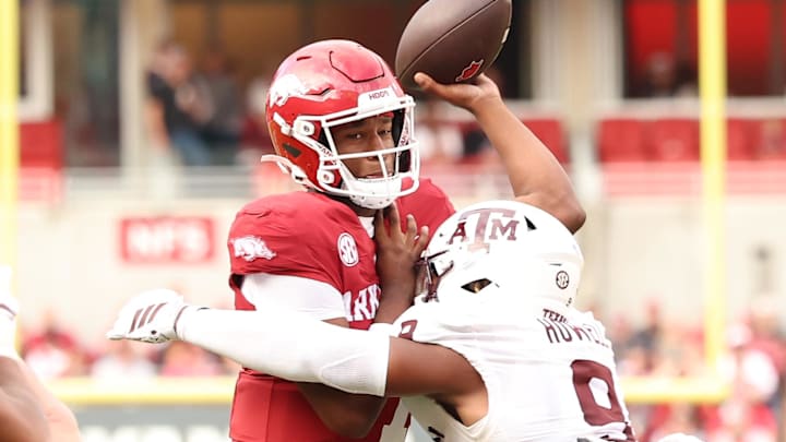 Arkansas Razorbacks quarterback KJ Jackson (7) attempts a pass in the first quarter as Texas A&M Aggies defensive end Cashius Howell (9) defends at Razorback Stadium.