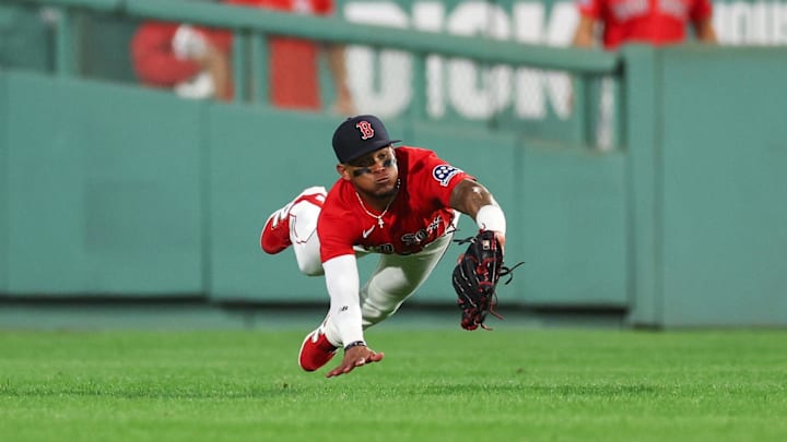 Jul 2, 2025; Boston, Massachusetts, USA; Boston Red Sox center fielder Ceddanne Rafaela (3) makes a diving catch during the seventh inning against the Cincinnati Reds at Fenway Park. Mandatory Credit: Paul Rutherford-Imagn Images