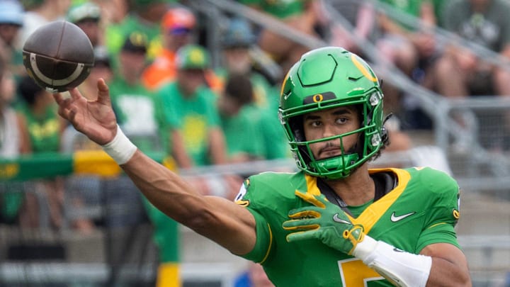 Oregon quarterback Dante Moore throws down field against Oklahoma State during the second quarter at Autzen.