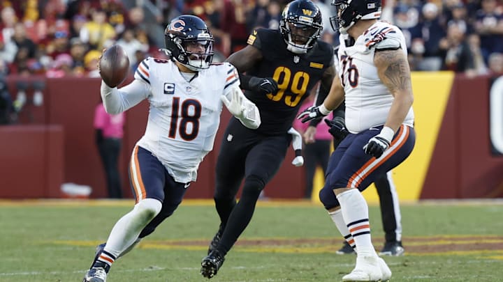 Caleb Williams first down against the Commanders.pump fakes and scrambles but is stopped short of a first down.