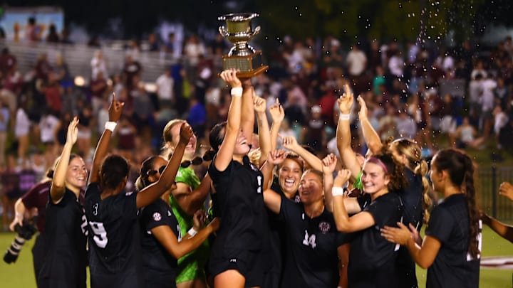 Mississippi State players celebrate a 2-0 win over Ole Miss to keep the Magnolia Cup in Starkville for another year. Mississippi State players celebrate a 2-0 win over Ole Miss to keep the Magnolia Cup in Starkville for another year.