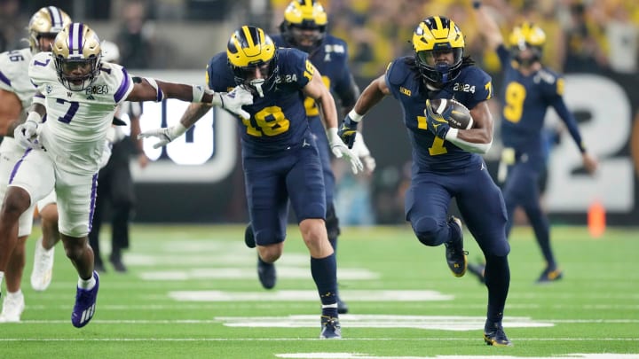 Michigan running back Donovan Edwards runs the ball in for a touchdown in the second quarter during the College Football Playoff national championship game against Washington at NRG Stadium in Houston, Texas on Monday, Jan. 8, 2024.