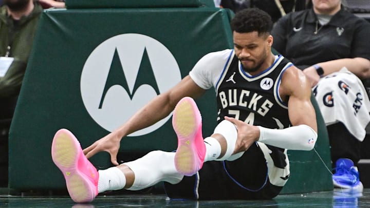 Mar 15, 2026; Milwaukee, Wisconsin, USA; Milwaukee Bucks forward Giannis Antetokounmpo (34) holds his knee after dunking a basket against the Indiana Pacers in the third quarter and had to leave the game at Fiserv Forum. Mandatory Credit: Benny Sieu-Imagn Images