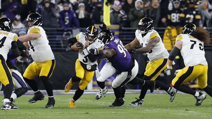 football player avoids defende