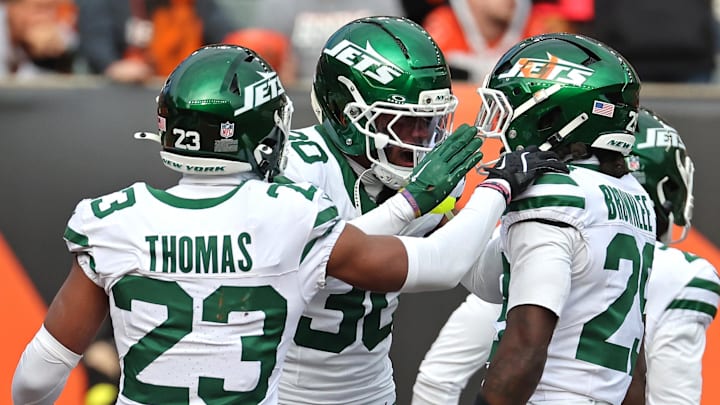 Oct 26, 2025; Cincinnati, Ohio, USA;  New York Jets cornerback Michael Carter II (30), cornerback Azareye'h Thomas (23) and cornerback Jarvis Brownlee Jr. (29) celebrates the game win at the end of the fourth quarter against the Cincinnati Bengals at Paycor Stadium. Mandatory Credit: Joseph Maiorana-Imagn Images