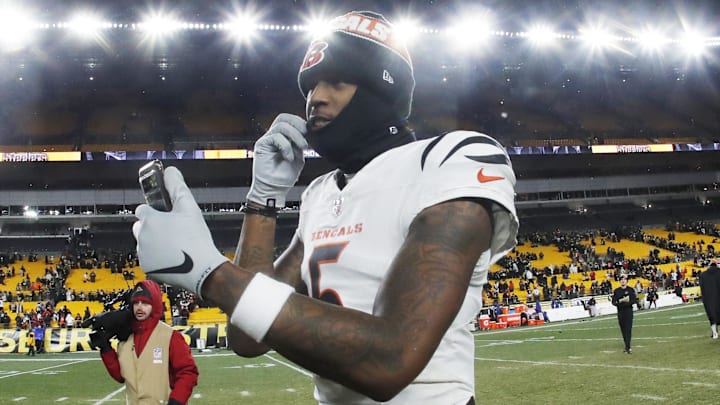 Jan 4, 2025; Pittsburgh, Pennsylvania, USA;  Cincinnati Bengals wide receiver Tee Higgins (5) goes live on social media after defeating the Pittsburgh Steelers at Acrisure Stadium. Mandatory Credit: Charles LeClaire-Imagn Images