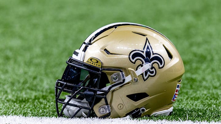 Jan 7, 2024; New Orleans, Louisiana, USA; Detailed view of the New Orleans Saints helmet during warmups against the Atlanta Falcons at Caesars Superdome. Mandatory Credit: Stephen Lew-Imagn Images