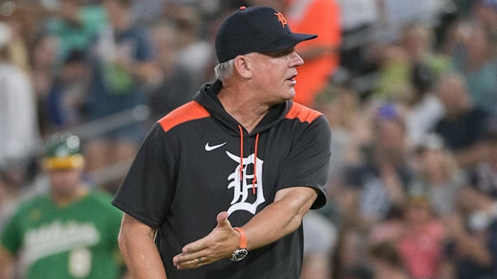 Detroit Tigers manager A.J. Hinch (14) motions to the home plate umpire during a mound visit in the fourth inning of the game against the Athletics at Sutter Health Park.