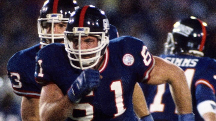 Jan 25, 1987; Pasadena, CA, USA; FILE PHOTO; New York Giants guard Chris Godfrey (61) in action against the Denver Broncos during Super Bowl XXI at the Rose Bowl. Jan 25, 1987; Pasadena, CA, USA; FILE PHOTO; New York Giants guard Chris Godfrey (61) in action against the Denver Broncos during Super Bowl XXI at the Rose Bowl.