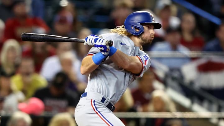 Texas Rangers left fielder Travis Jankowski (16) hits a two run double.