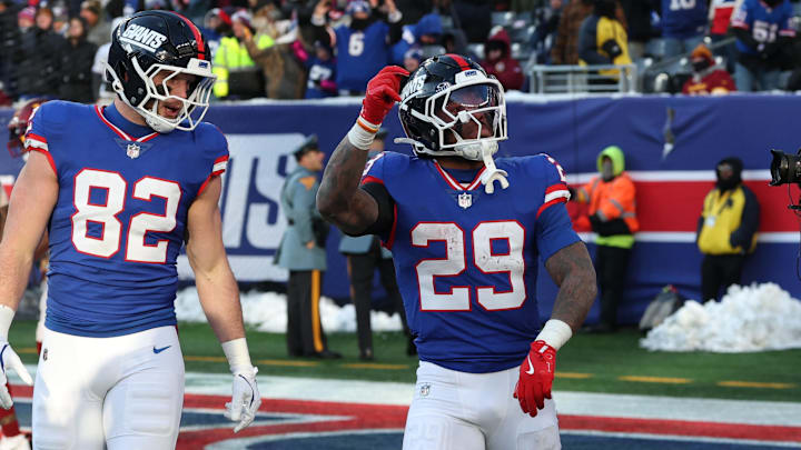 Dec 14, 2025; East Rutherford, New Jersey, USA; New York Giants running back Tyrone Tracy Jr. (29) celebrates a touchdown during the fourth quarter against the Washington Commanders at MetLife Stadium. Dec 14, 2025; East Rutherford, New Jersey, USA; New York Giants running back Tyrone Tracy Jr. (29) celebrates a touchdown during the fourth quarter against the Washington Commanders at MetLife Stadium.