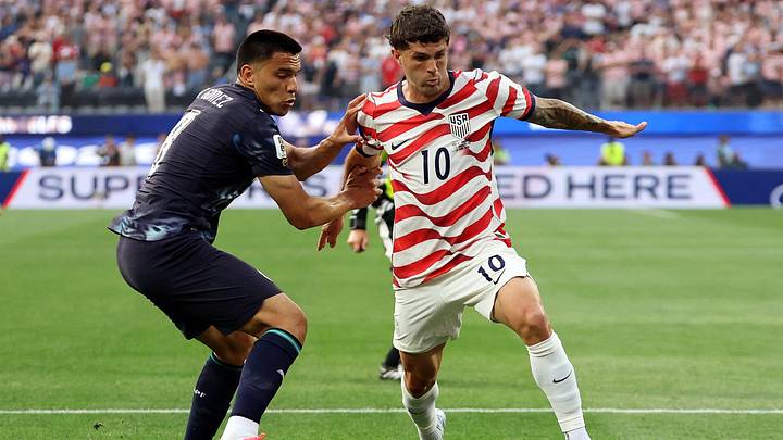  June 12, 2026; Inglewood, California, U.S.; Christian Pulisic of the U.S. in action with Paraguay's Diego Gomez.  Mandatory Credit: Kiyoshi Mio-Imagn Images 