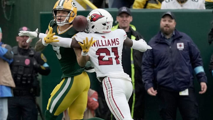 Arizona Cardinals cornerback Garrett Williams (21) breaks up a pas sin the end zone intended for Green Bay Packers wide receiver Christian Watson (9) during the first quarter of their game Sunday, October 13, 2024 at Lambeau Field in Green Bay, Wisconsin. Arizona Cardinals cornerback Garrett Williams (21) breaks up a pas sin the end zone intended for Green Bay Packers wide receiver Christian Watson (9) during the first quarter of their game Sunday, October 13, 2024 at Lambeau Field in Green Bay, Wisconsin.