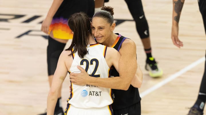 Phoenix Mercury guard Diana Taurasi (3) embraces Indiana Fever guard Caitlin Clark (22) before tipoff on June 30, 2024, at Footprint Center in Phoenix.