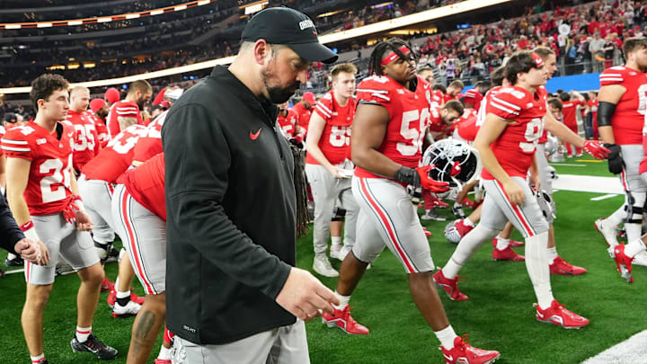 Dec 29, 2023; Arlington, Texas, USA; Ohio State Buckeyes head coach Ryan Day walks off the field