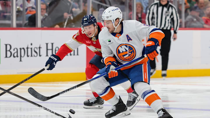 Dec 7, 2025; Sunrise, Florida, USA; New York Islanders defenseman Ryan Pulock (6) moves the puck against Florida Panthers center Carter Verhaeghe (23) during the third period at Amerant Bank Arena. Mandatory Credit: Sam Navarro-Imagn Images Dec 7, 2025; Sunrise, Florida, USA; New York Islanders defenseman Ryan Pulock (6) moves the puck against Florida Panthers center Carter Verhaeghe (23) during the third period at Amerant Bank Arena. Mandatory Credit: Sam Navarro-Imagn Images